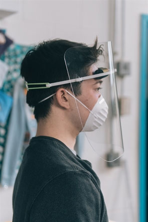 Bioengineering senior, Kyle Ritchie demonstrating the face shield.