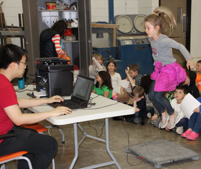 Students jump on an instrumented platform to make their own &quot;earthquakes.&quot;