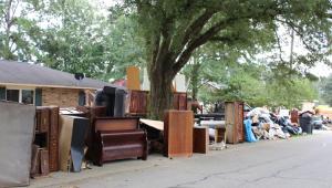 Household items damaged by flood waters lined the streets.