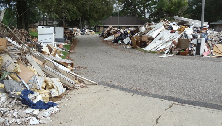 &quot;Tunnels of debris&quot; were common along residential streets during clean-up efforts.