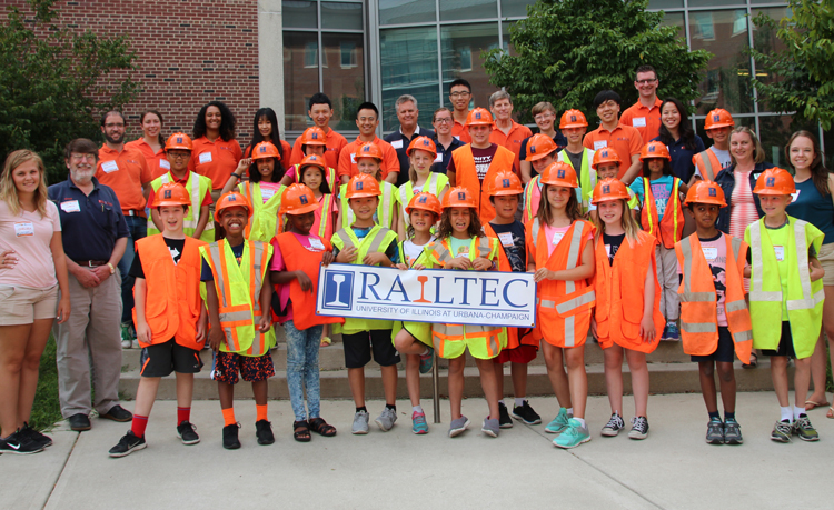 The students donned hard hats and safety vests for a group photo at the end of the busy day.