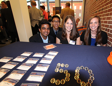 students help out at alumni reception