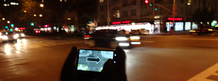 a researcher uses a smart phone app developed at Illinois to record traffic in New York City.