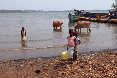 In Kenya, children draw water from Lake Victoria