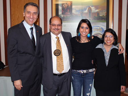 Professor Praveen Kumar (second from left) poses on the day of his investiture with (from left) Professor and Head Amr S. Elnashai; Kumar's daughter, Ilina; and his wife, Charu.