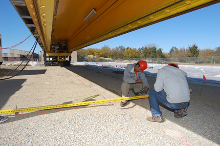 Researchers work under the Advanced Transportation and Loading Assembly at the Illinois Center for Transportation