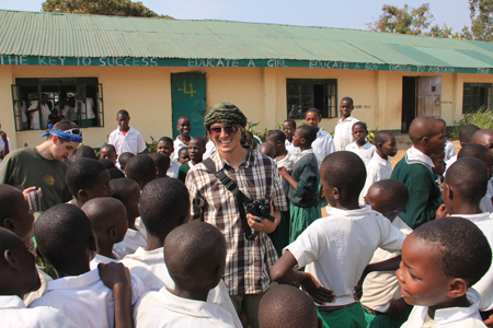 CEE student Matt Sokolowski (left, green t-shirt) and partner student Patricio Roa Garduno from King Abdullah University of Science and Technology talk to children at a Kenyan primary school. 