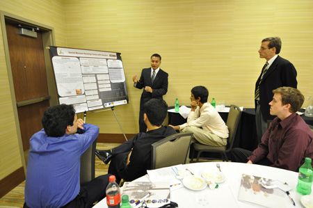 Man giving presentation to group of students