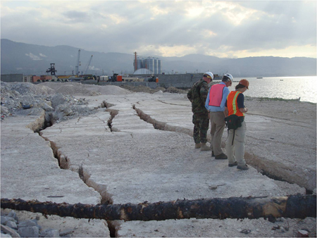 GEER team members examine damage at the wharf in Port-au-Prince