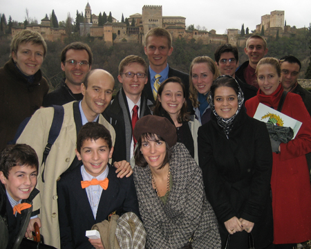Roundtable organizers and participants post in front of the Alhambra in Grenada