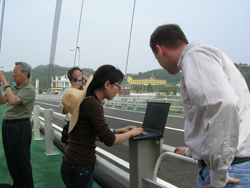 Researchers work on the Jindo bridge during deployment of the structural monitoring system in June 2009.