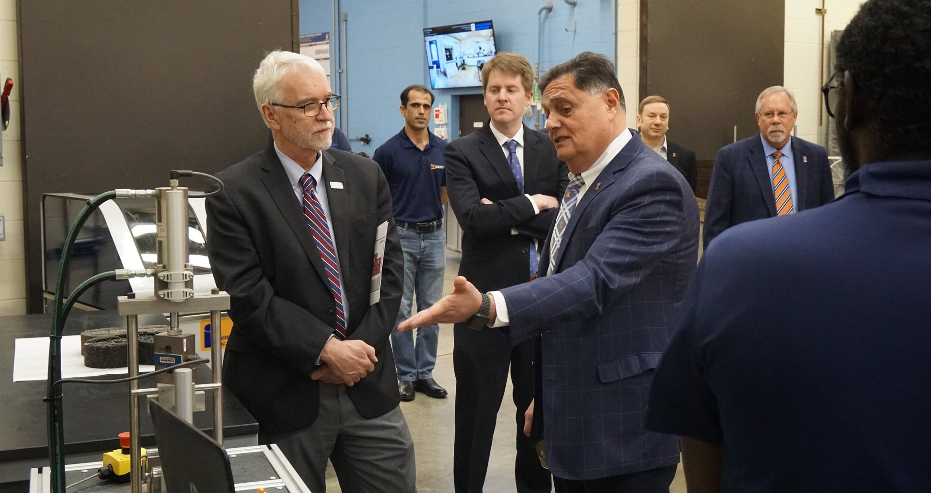 Imad Al-Qadi, Illinois Center for Transportation director and University of Illinois Urbana-Champaign Bliss Professor of Engineering, shows President Killeen the Illinois Flexibility Index Test. Developed by ICT researchers, I-FIT can predict the cracking potential of hot-mix asphalt materials.