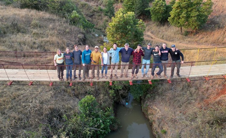 Grainger Engineering students with the EIA Bridge Program join the Virginia Tech and University of Iowa teams on the completed KaZenzele Footbridge in Eswatini. The University of Illinois team are: Rachel Chen (BS 25, Civil Engineering), Colin&nbsp;Zimmers (BS 24, Engineering Mechanics), Aaron Perez&nbsp;Arraya (BS 26, Engineering Undeclared), Dion Shen (BS 25, Civil Engineering) and&nbsp;Soren Mayendia (BS 25, Civil Engineering). (Photo courtesy of Rachel Chen)