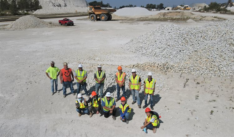 Provided by Erol Tutumluer. The researchers pose to a drone in front of a riprap stockpile at a visit to a quarry in Kankakee, Illinois.