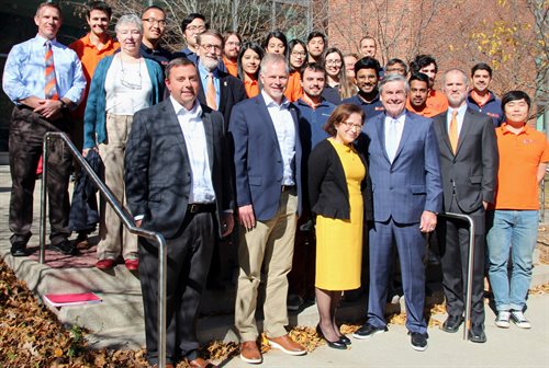 Front row, from left, Hanson Professional Services Inc.&amp;rsquo;s Mike Mendenhall (BS 02) and Mat Fletcher (BS 94); Ana Barros, CEE head; and Hanson&amp;rsquo;s Chairman and CEO Sergio &amp;ldquo;Satch&amp;rdquo; Pecori (BS 73, MS 74) stand with faculty and students of UIUC&amp;rsquo;s Rail Transportation and Engineering Center outside the University&amp;rsquo;s Newmark Civil Engineering Laboratory on Oct. 28 after Hanson pledged $150,000 to the center.