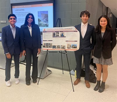 University of Illinois Urbana-Champaign undergraduate students Desi Nainar, Tara Reddy, Shiraz Baxamusa and Hayley Kieu, from left, pose in front of their first-place poster at the PURE Research Symposium on December 2.
