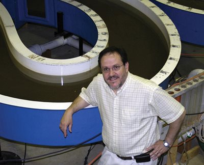 Garcia near a model of the Chicago River, which his research team built as part of their work with the Metropolitan Water Reclamation District of Greater Chicago.