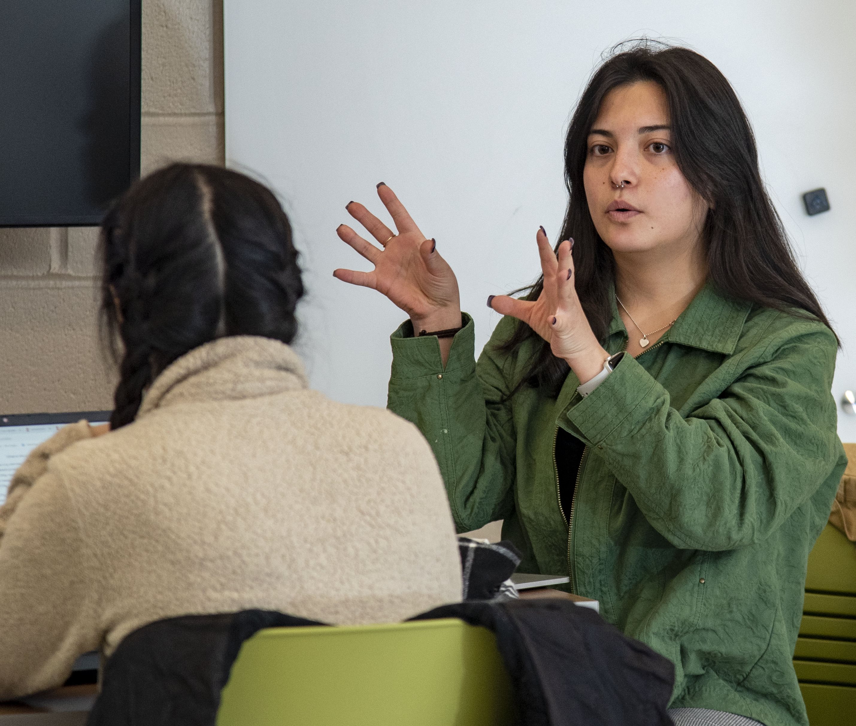 CEE senior Halie Collins, president of the Illinois Solar Decathlon student organization, at one of the weekly meetings held by the group.