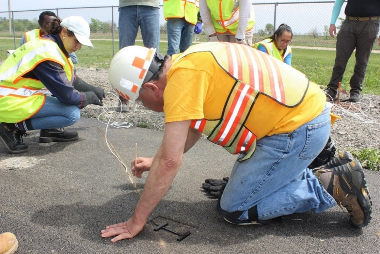 Al-Qadi places a strain gauge cable embedded in a base layer saw cut on May 15. Al-Qadi&amp;amp;amp;rsquo;s team instrumented the test area with 53 sensors to measure strain from simulated traffic loads using ICT&amp;amp;amp;rsquo;s Accelerated Transportation Loading System as well as temperature.