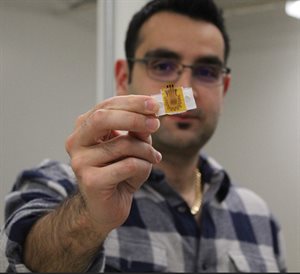 Houtan Jebelli holds a prototype of a wearable sensor