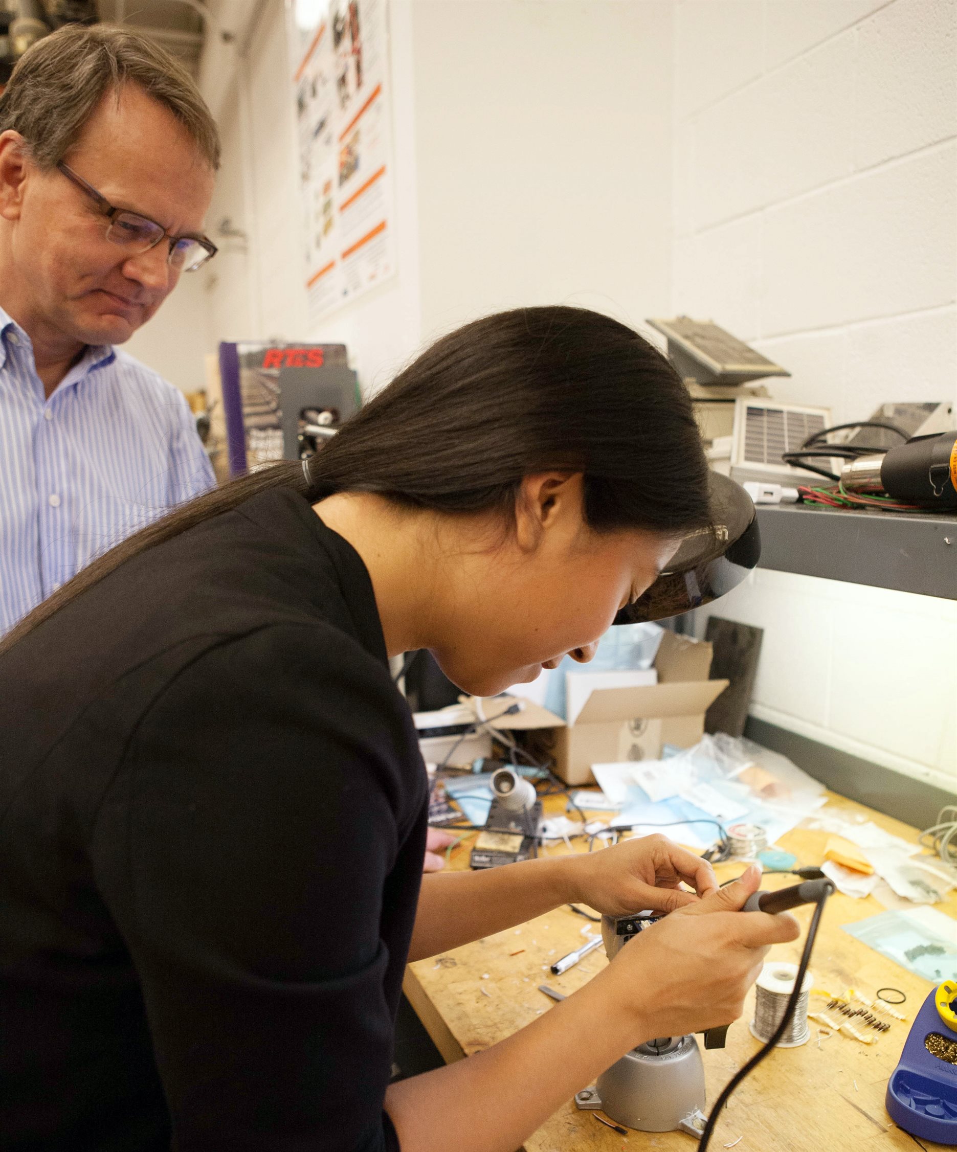 Working with Martha Cuenca on a wireless sensor board being developed in the Smart Structures Technology Lab at UIUC.
