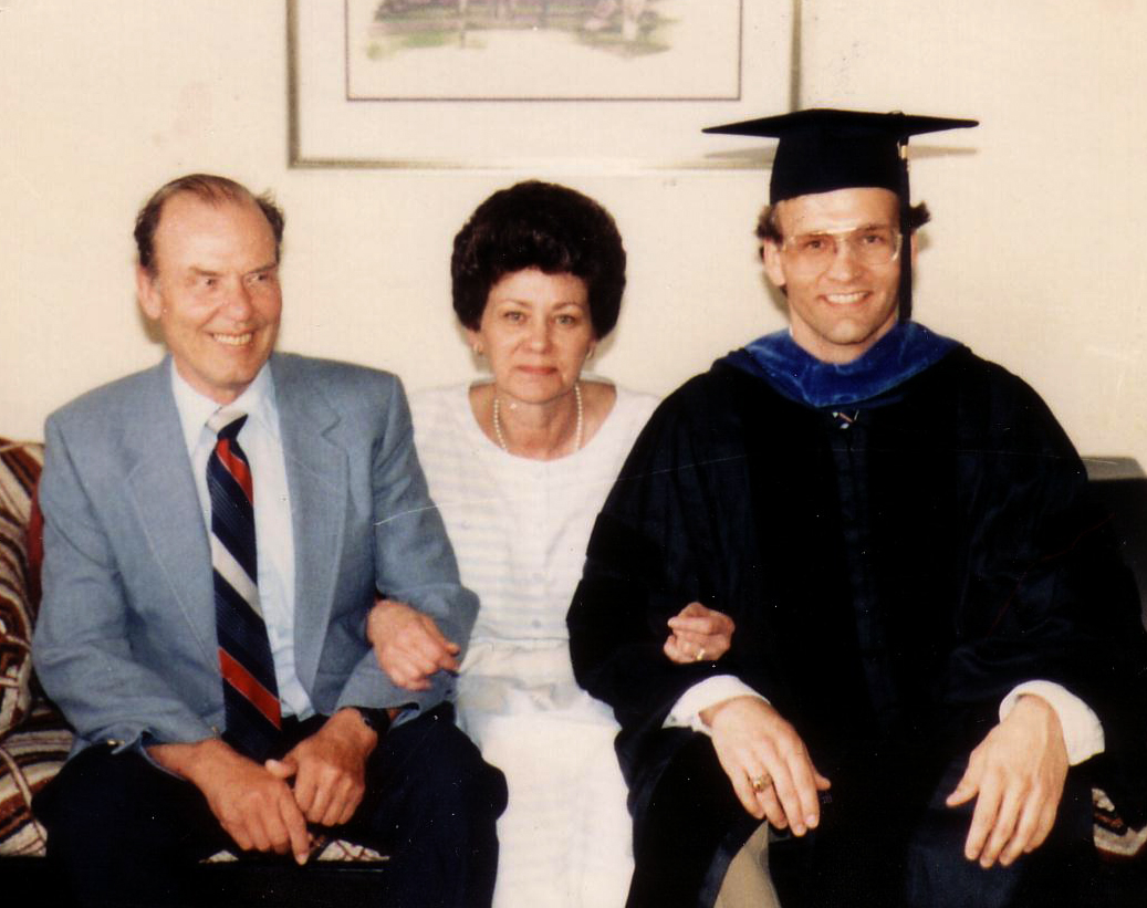 Spencer with his parents at UIUC Ph.D. graduation ceremony in Champaign.