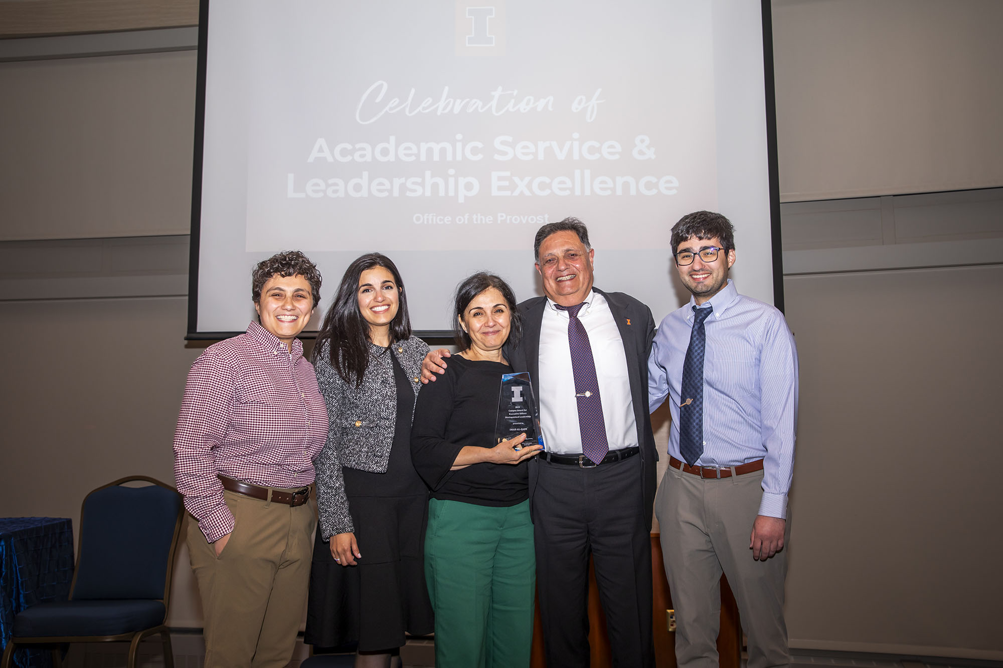 Al-Qadi smiles with his family at the award ceremony on May 14.&amp;nbsp;