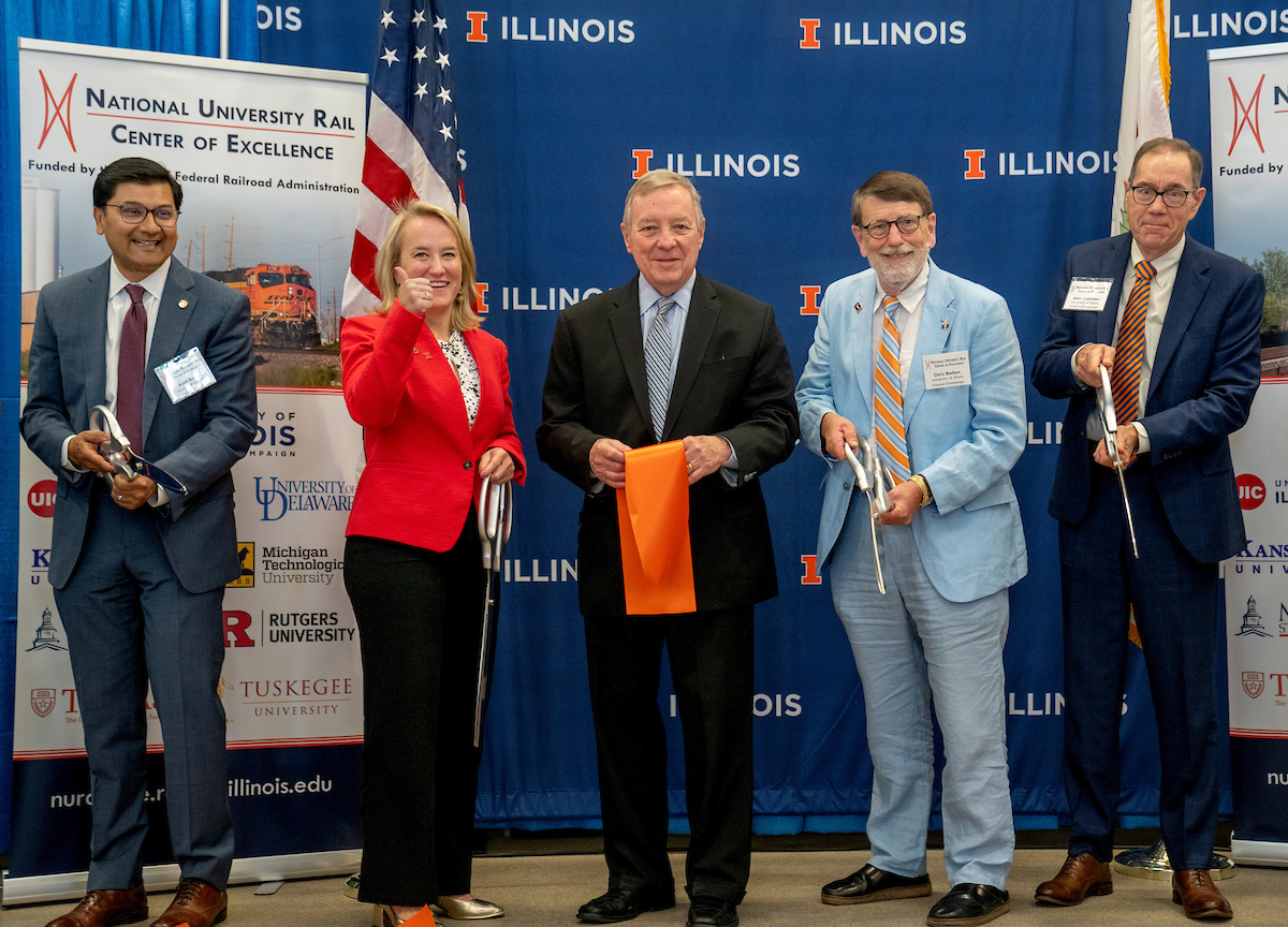 Left to right: Federal Railroad Administration Administrator Amit Bose, Illinois Representative Nikki Budzinski, Illinois Senator Dick Durbin, CEE professor Chris&nbsp;Barkan, and University of&nbsp;Illinois Provost John Coleman.&nbsp;&nbsp;<br><br>Photo credit: <em>Heather Coit</em>