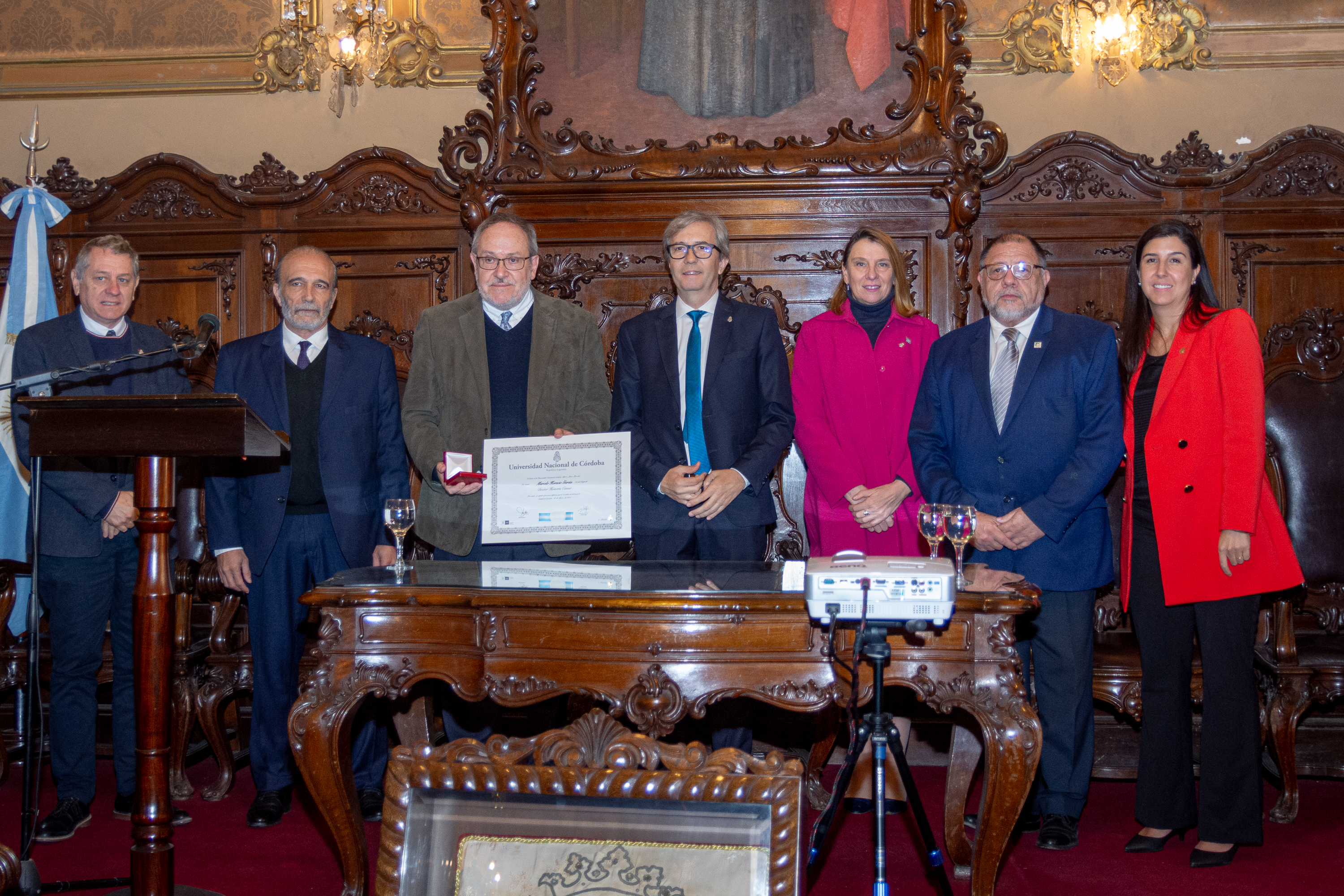 <em>Left to right: National University of Cordoba (UNC) Undersecretary Daniel Lagos, Minister of Infrastructure and Public Services of Cordoba Province Fabian Lopez (MS 94, PhD 97), Honoree Marcelo Garcia, UNC Rector Jhon Boretto, UNC Vice-Rector Mariela Marchisio, UNC Dean of Engineering and Science Pablo Recabarren, and UNC Vice-Dean of Engineering and Science Magali Carro Perez. Photo courtesy Marcelo Garcia</em>